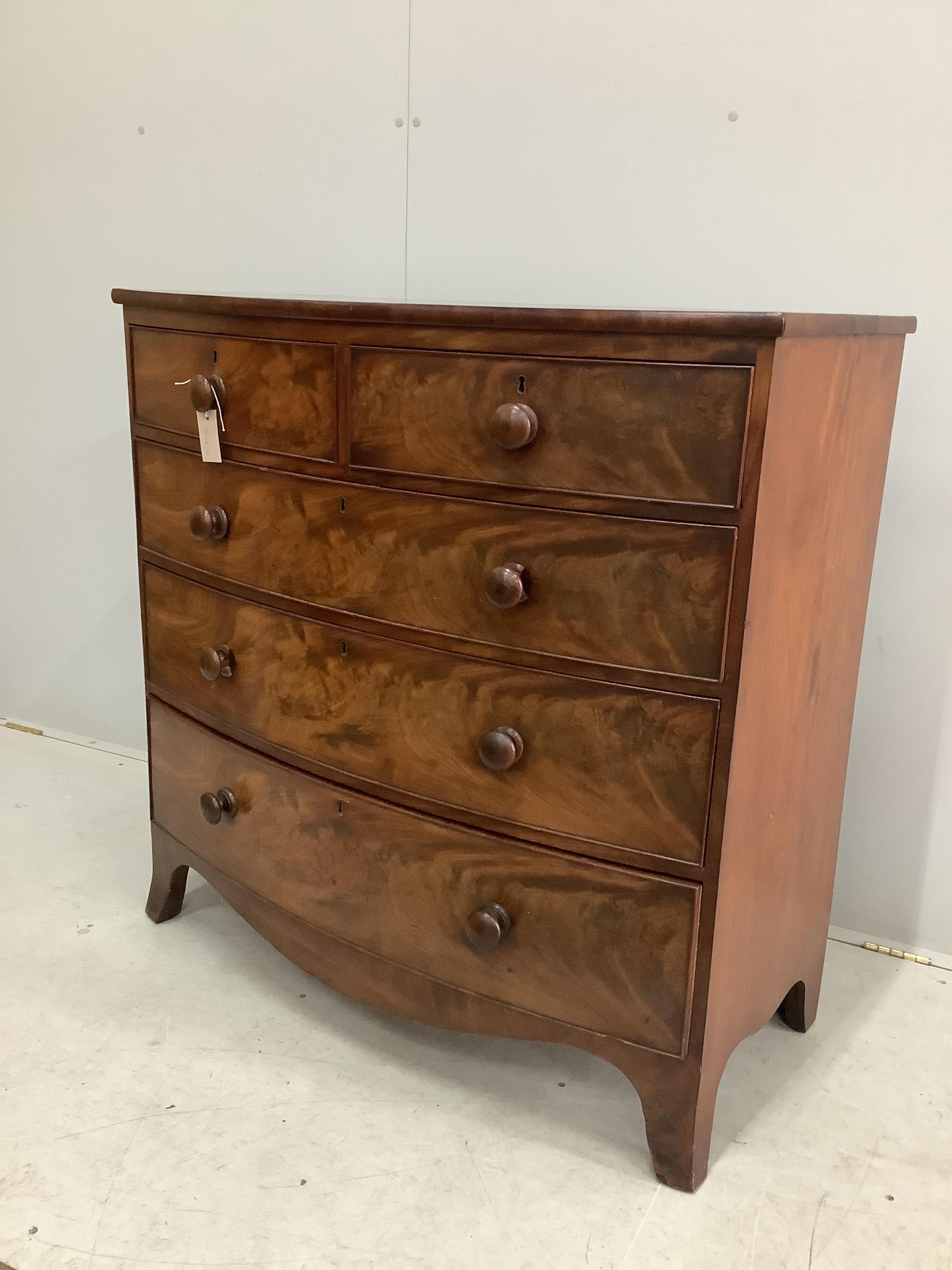 A Regency mahogany bow front chest of drawers, width 105cm, depth 52cm, height 104cm. Condition - fair